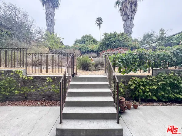 a view of hallway with an empty room