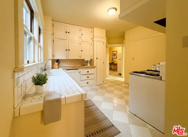 a view of a kitchen cabinets and wooden floor