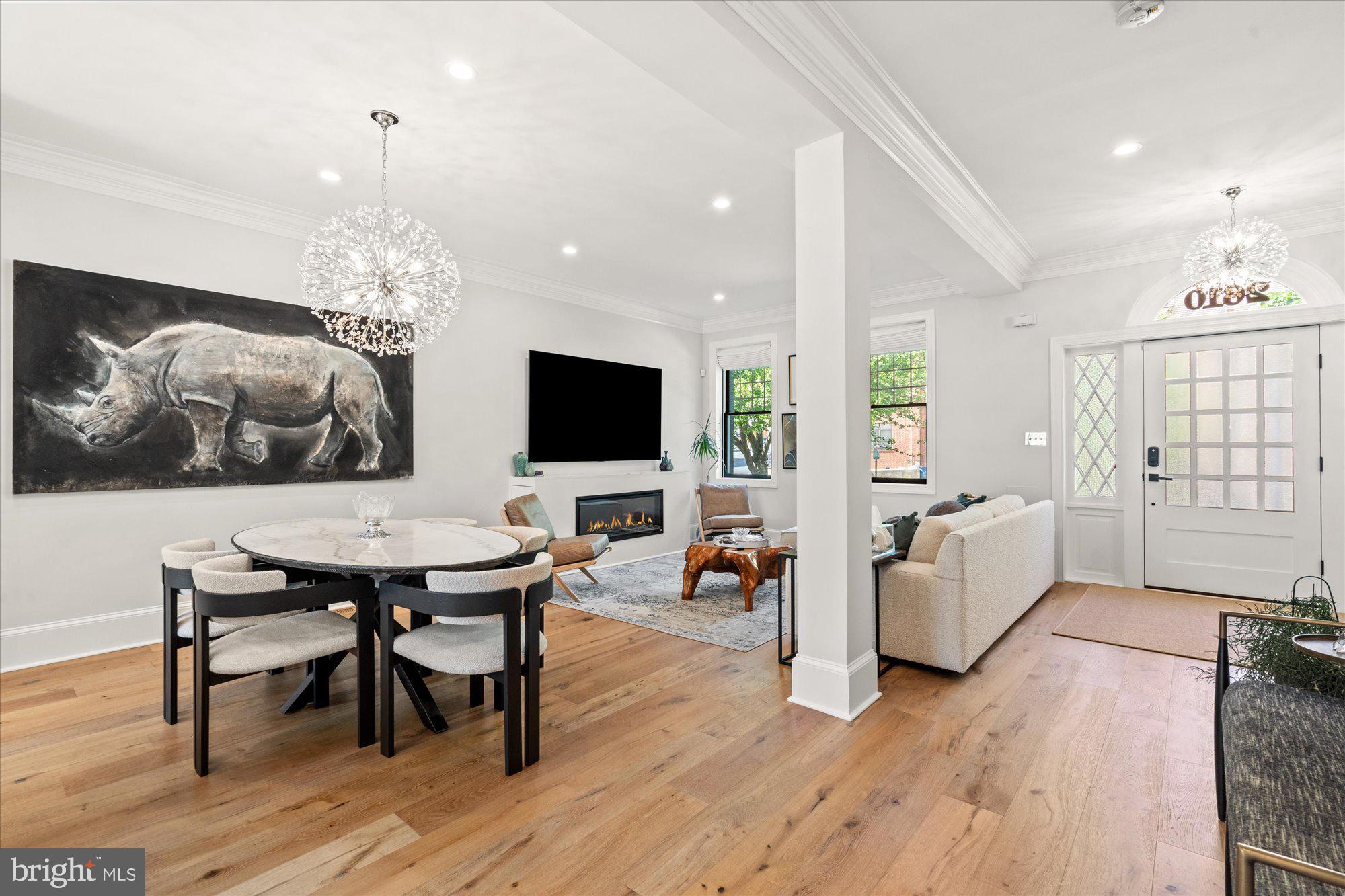 2610 Garfield Street Northwest Washington, DC 20008 - Photo 5 of 51 a view of a dining room with furniture wooden floor and chandelier