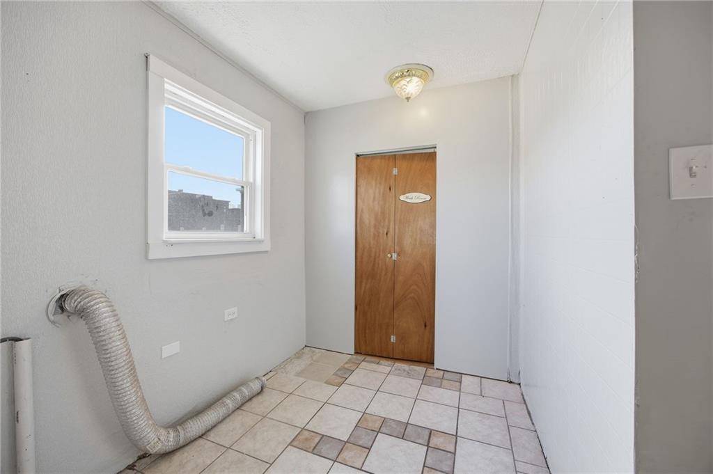 212 Comrie Avenue Braddock, PA 15104 - Photo 15 of 18 a view of an empty room with a window