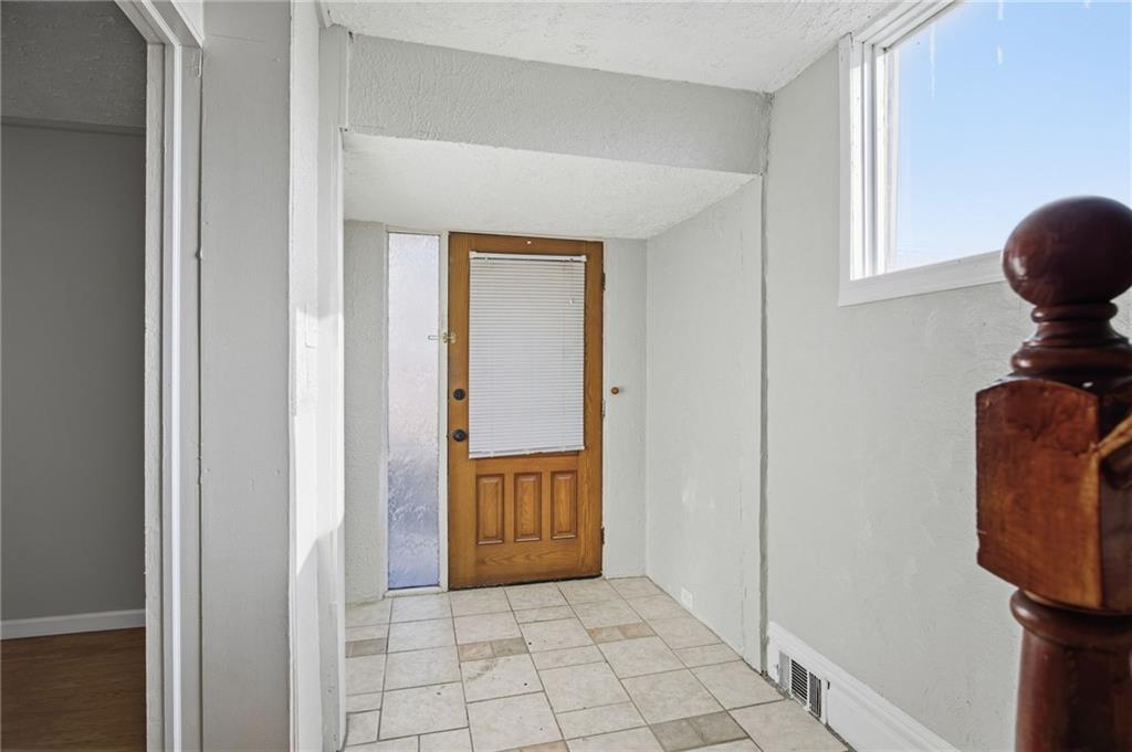 212 Comrie Avenue Braddock, PA 15104 - Photo 17 of 18 a view of hallway with washer and dryer