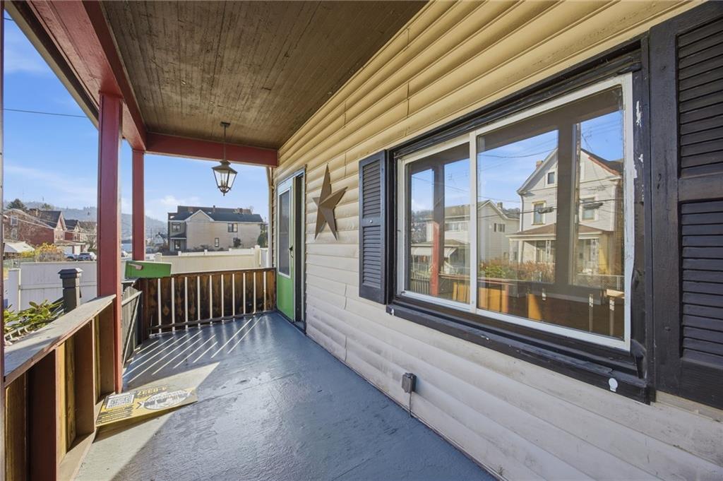 212 Comrie Avenue Braddock, PA 15104 - Photo 18 of 18 a view of a porch with wooden floor of the house