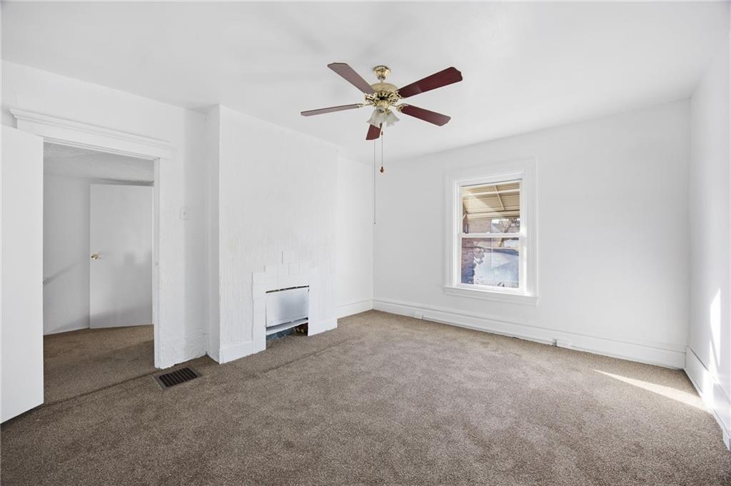 212 Comrie Avenue Braddock, PA 15104 - Photo 8 of 18 an empty room with fan and windows
