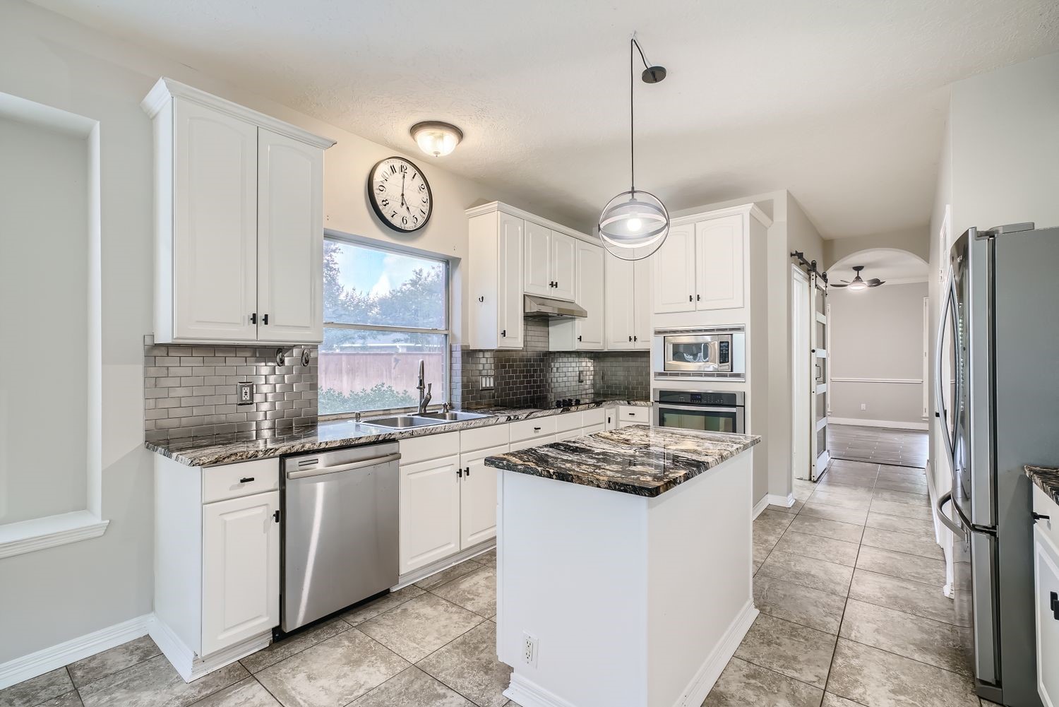 17 Leandro Court Montgomery, TX 77356 - Photo 11 of 38 a kitchen with refrigerator cabinets and stainless steel appliances
