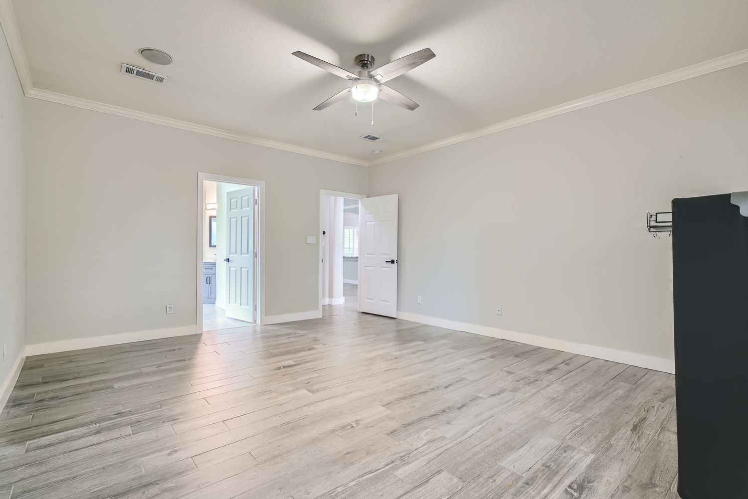 17 Leandro Court Montgomery, TX 77356 - Photo 18 of 38 an empty room with wooden floor and ceiling fan