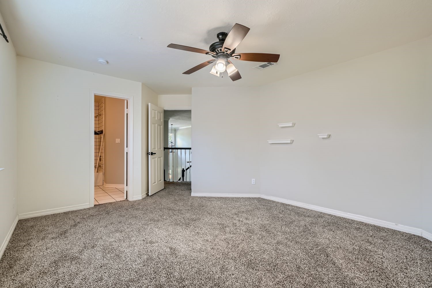 17 Leandro Court Montgomery, TX 77356 - Photo 27 of 38 a view of empty room with a ceiling fan