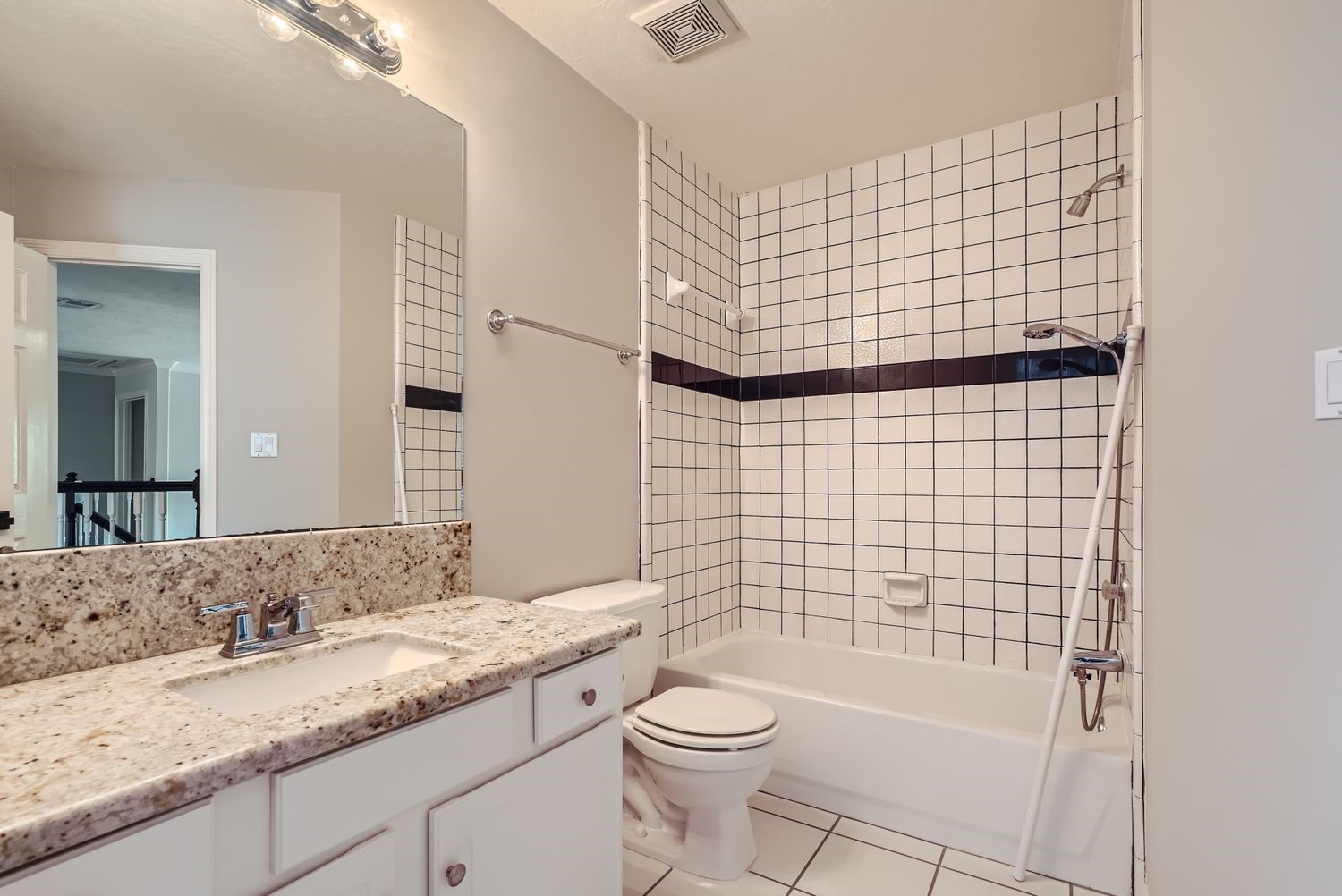 17 Leandro Court Montgomery, TX 77356 - Photo 30 of 38 a bathroom with a granite countertop toilet sink and mirror