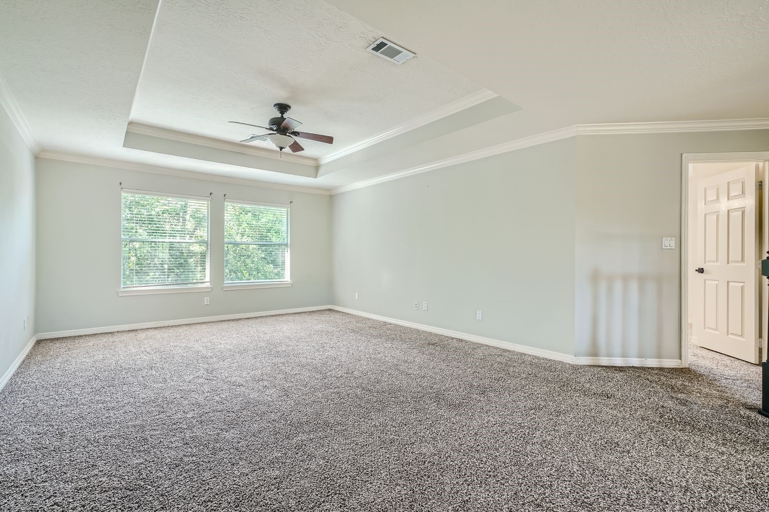 17 Leandro Court Montgomery, TX 77356 - Photo 32 of 38 an empty room with a window and a ceiling fan