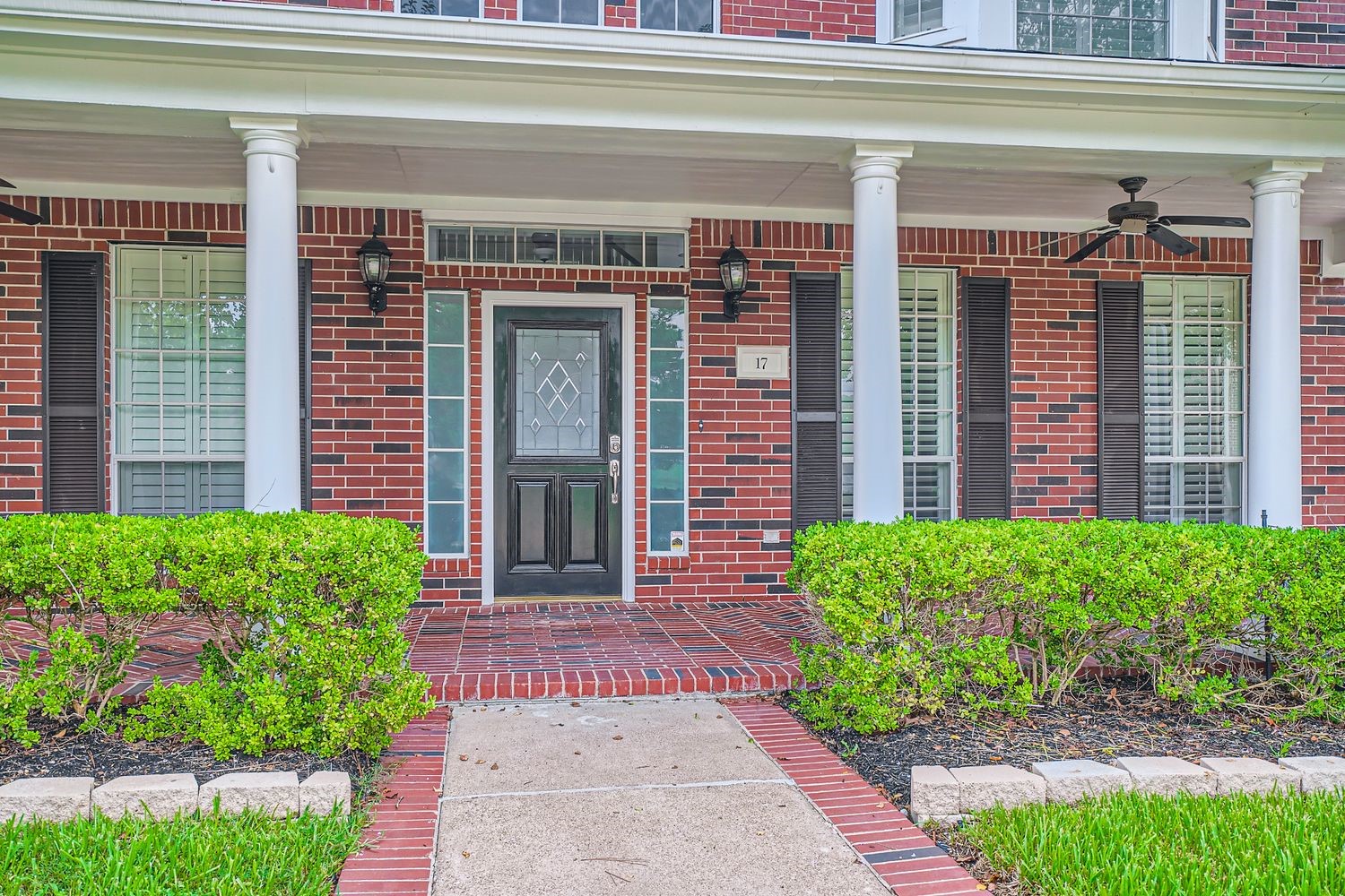 17 Leandro Court Montgomery, TX 77356 - Photo 4 of 38 a front view of a house with a yard and plants