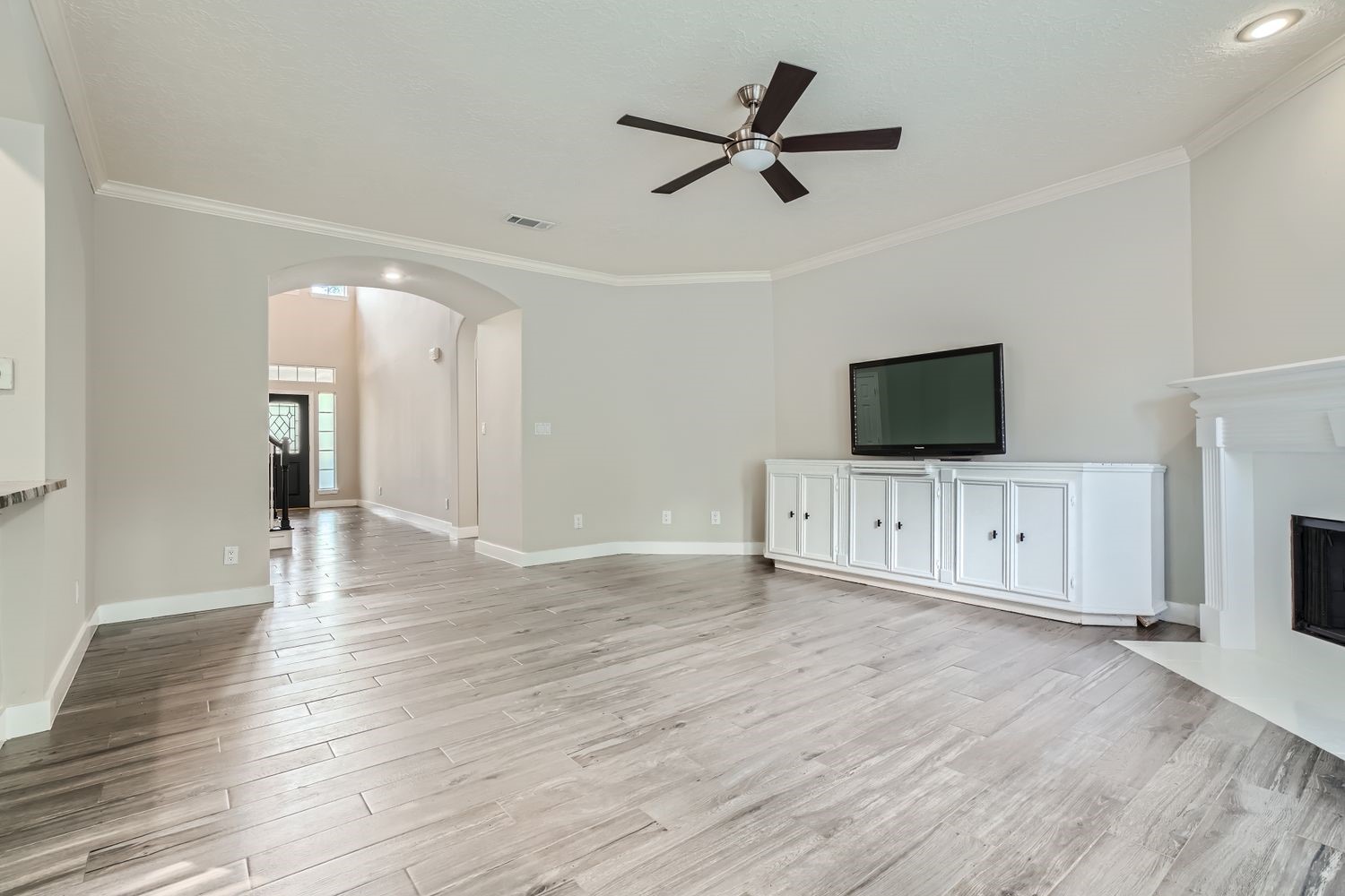 17 Leandro Court Montgomery, TX 77356 - Photo 6 of 38 a view of livingroom with wooden floor and flat screen tv