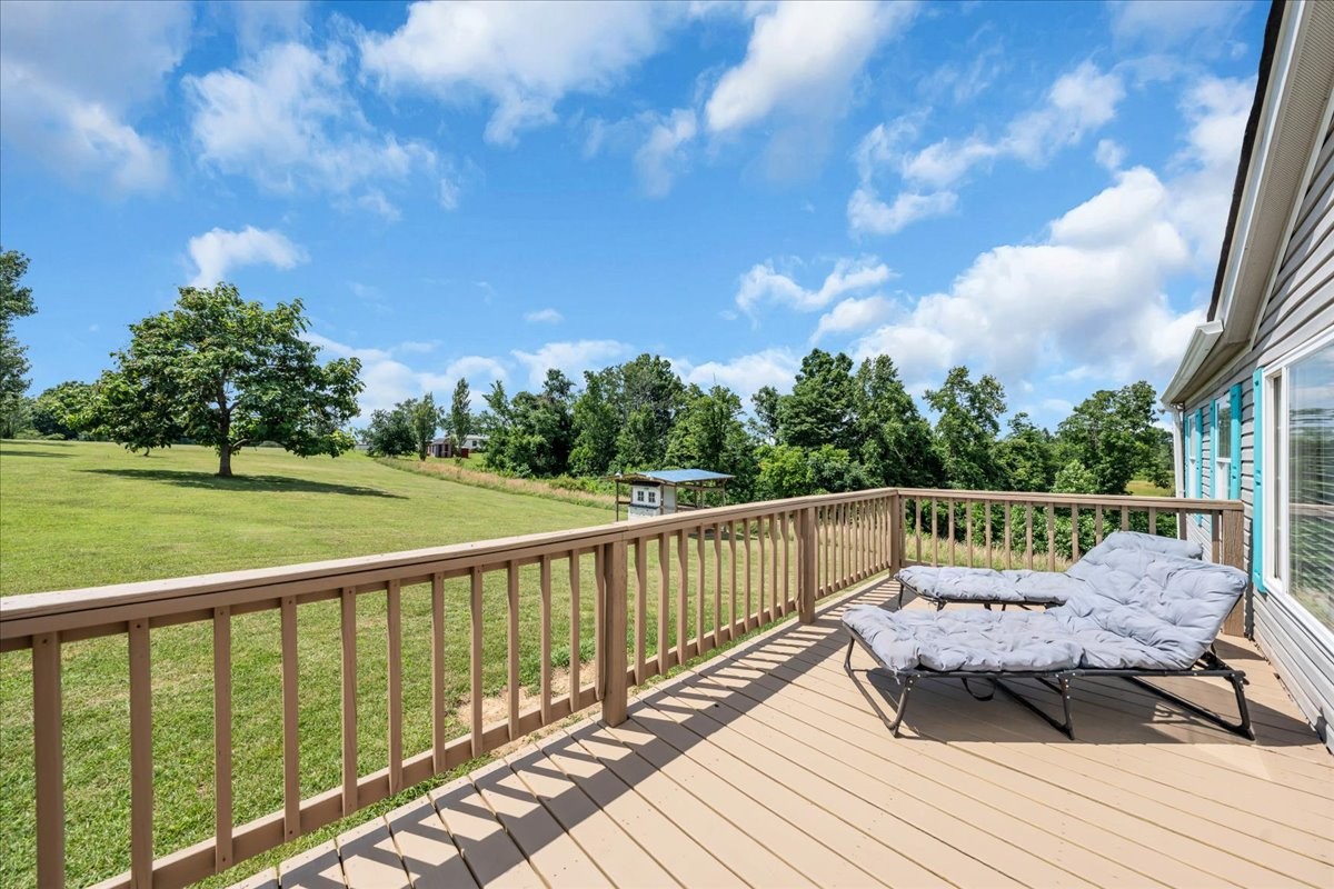 2657 Oak Grove Road Red Boiling Springs, TN 37150 - Photo 6 of 45 a view of a wooden deck with furniture