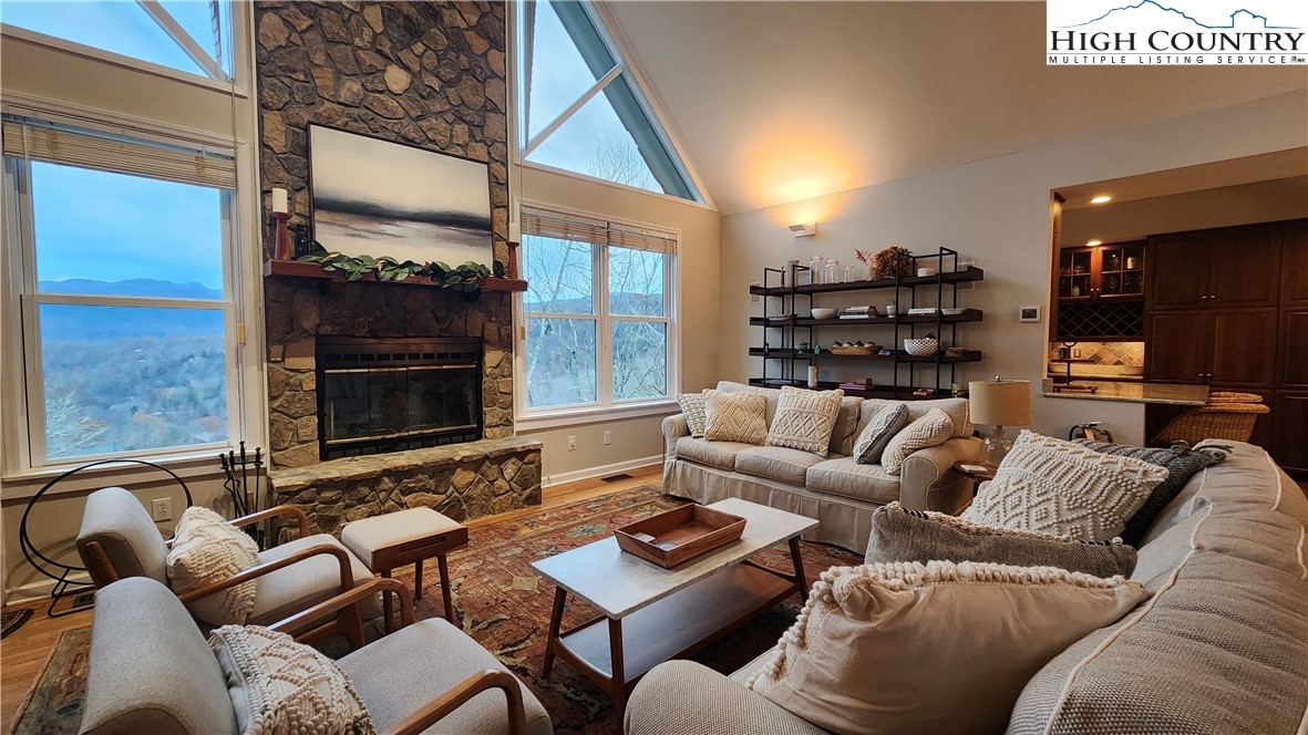 a living room with furniture and a fireplace