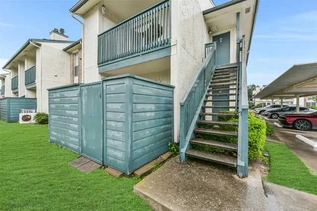 a view of a house with a small yard