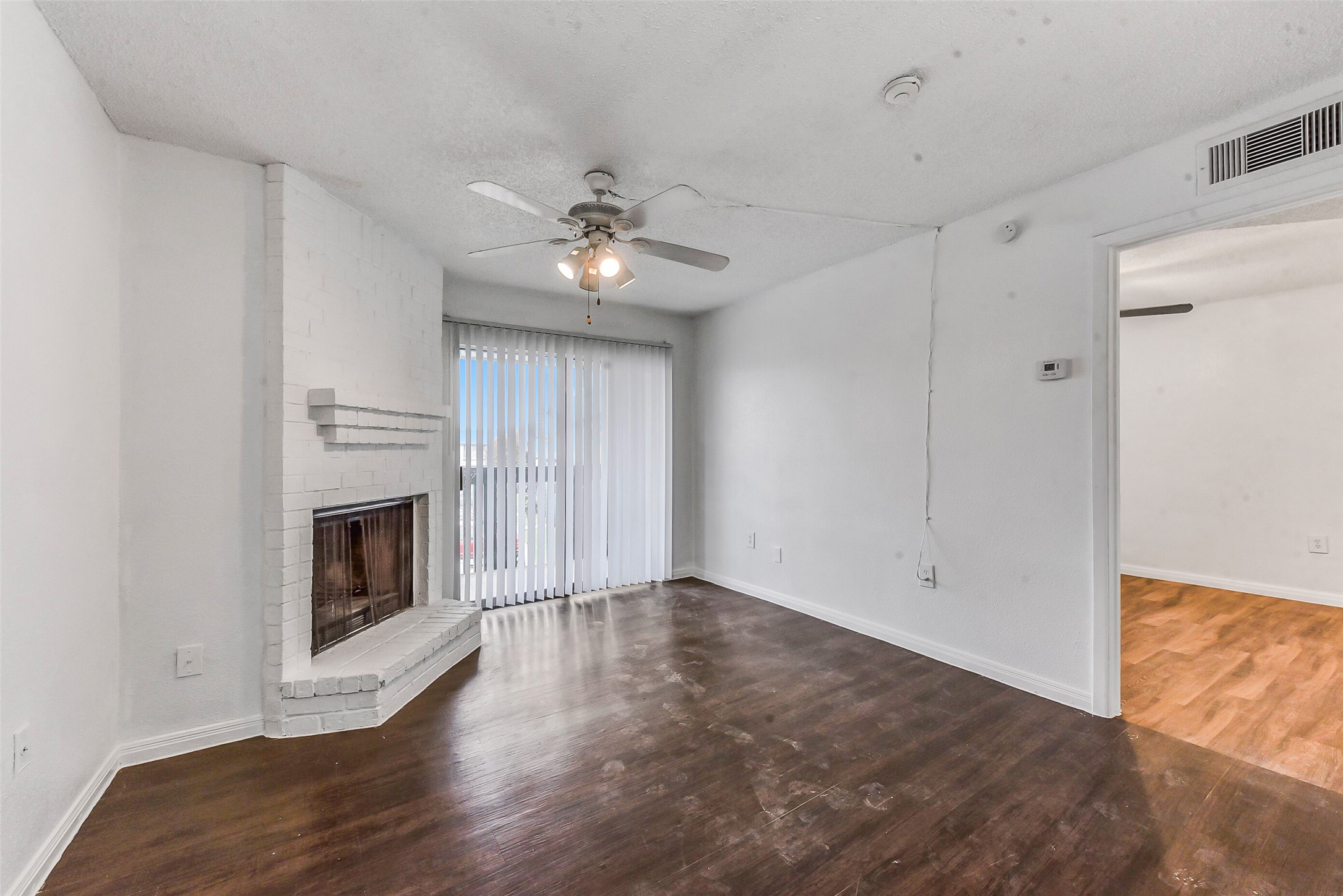 250 El Dorado Boulevard, Unit 248 Webster, TX 77598 - Photo 2 of 16 a view of an empty room with a fireplace and a window