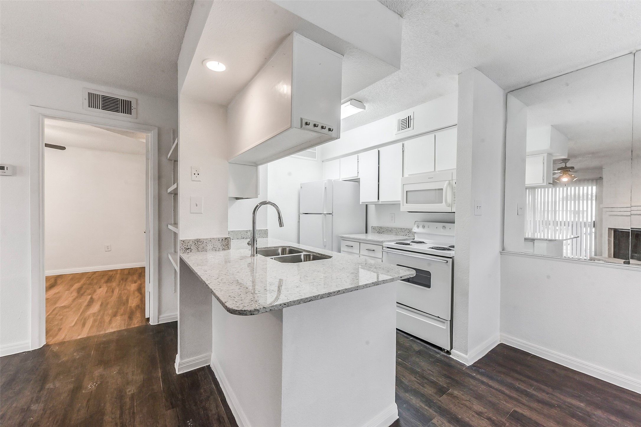 250 El Dorado Boulevard, Unit 248 Webster, TX 77598 - Photo 4 of 16 a kitchen with stainless steel appliances granite countertop a sink stove and refrigerator