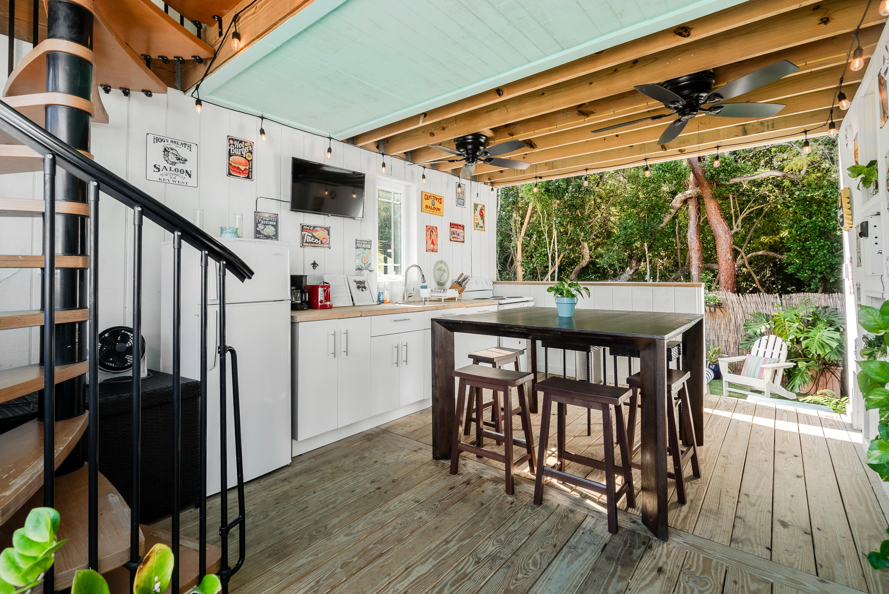 a view of a patio with table and chairs a barbeque with wooden floor and outdoor space