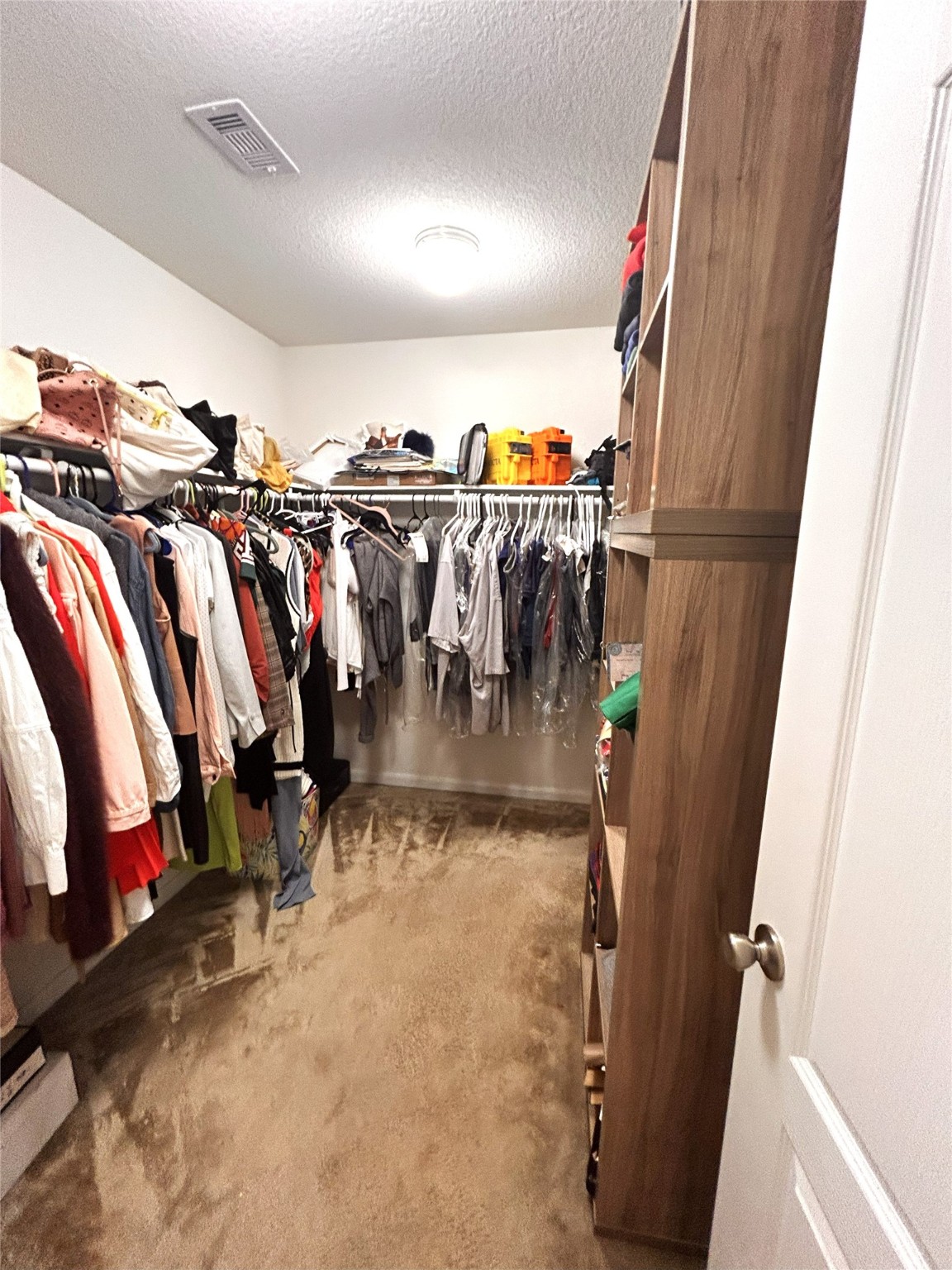 9839 Mills Field Drive Houston, TX 77070 - Photo 2 of 19 a view of walk in closet with clothes and shoes
