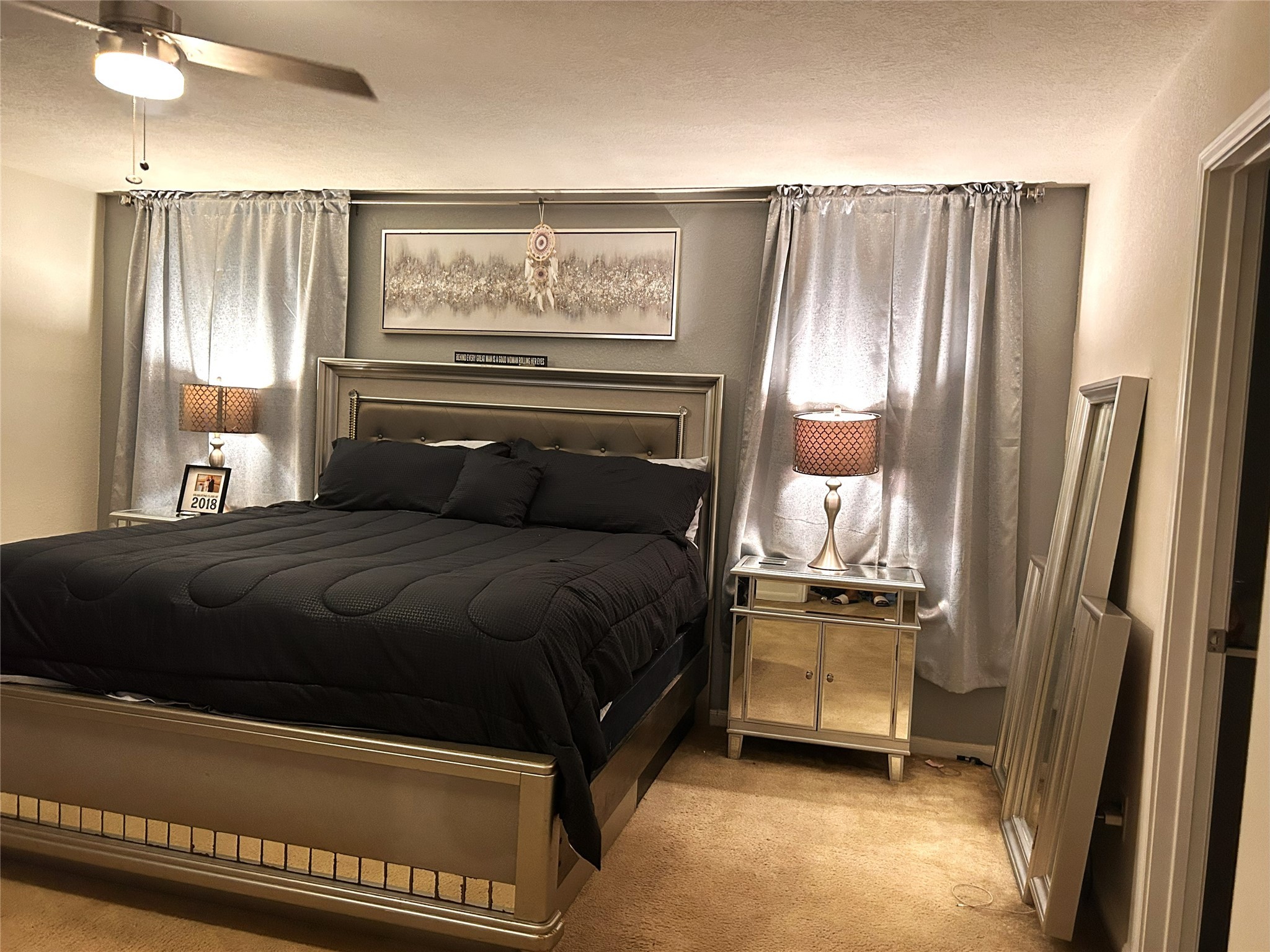 9839 Mills Field Drive Houston, TX 77070 - Photo 8 of 19 a bedroom with a bed and a refrigerator