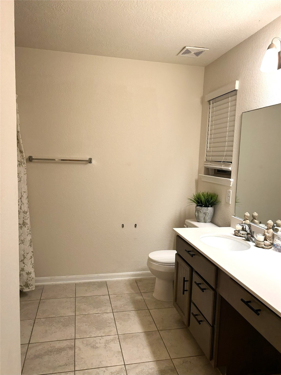 9839 Mills Field Drive Houston, TX 77070 - Photo 10 of 19 a bathroom with a sink a toilet and mirror