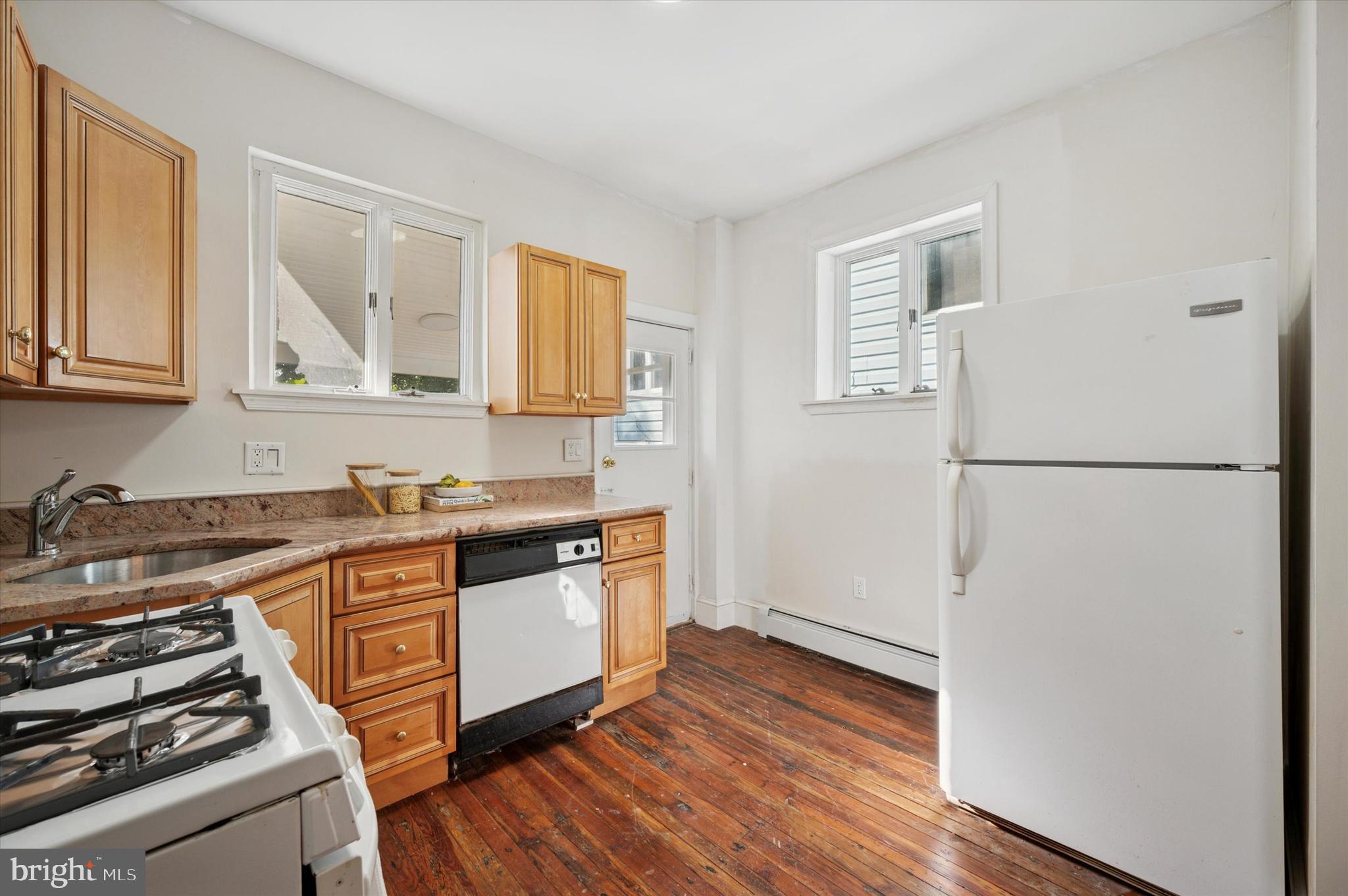 610 Martin Street Philadelphia, PA 19128 - Photo 12 of 24 a kitchen with stainless steel appliances a stove and a refrigerator