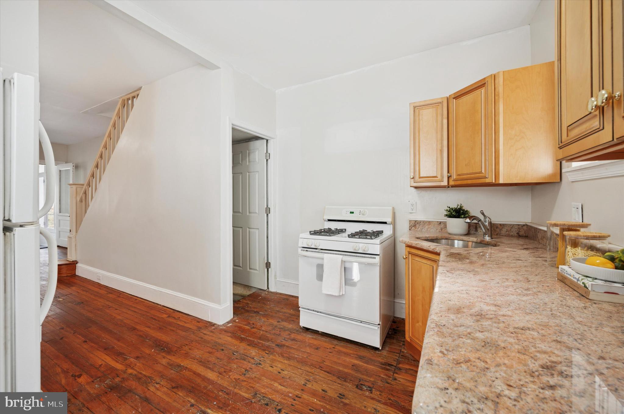 610 Martin Street Philadelphia, PA 19128 - Photo 13 of 24 a view of a kitchen with wooden floor and electronic appliances