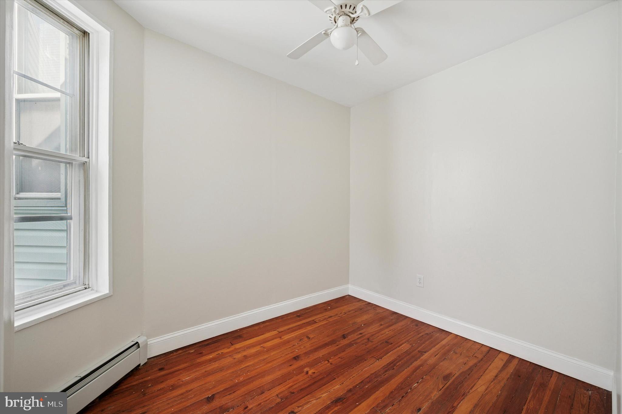 610 Martin Street Philadelphia, PA 19128 - Photo 14 of 24 a view of an empty room with wooden floor and a window