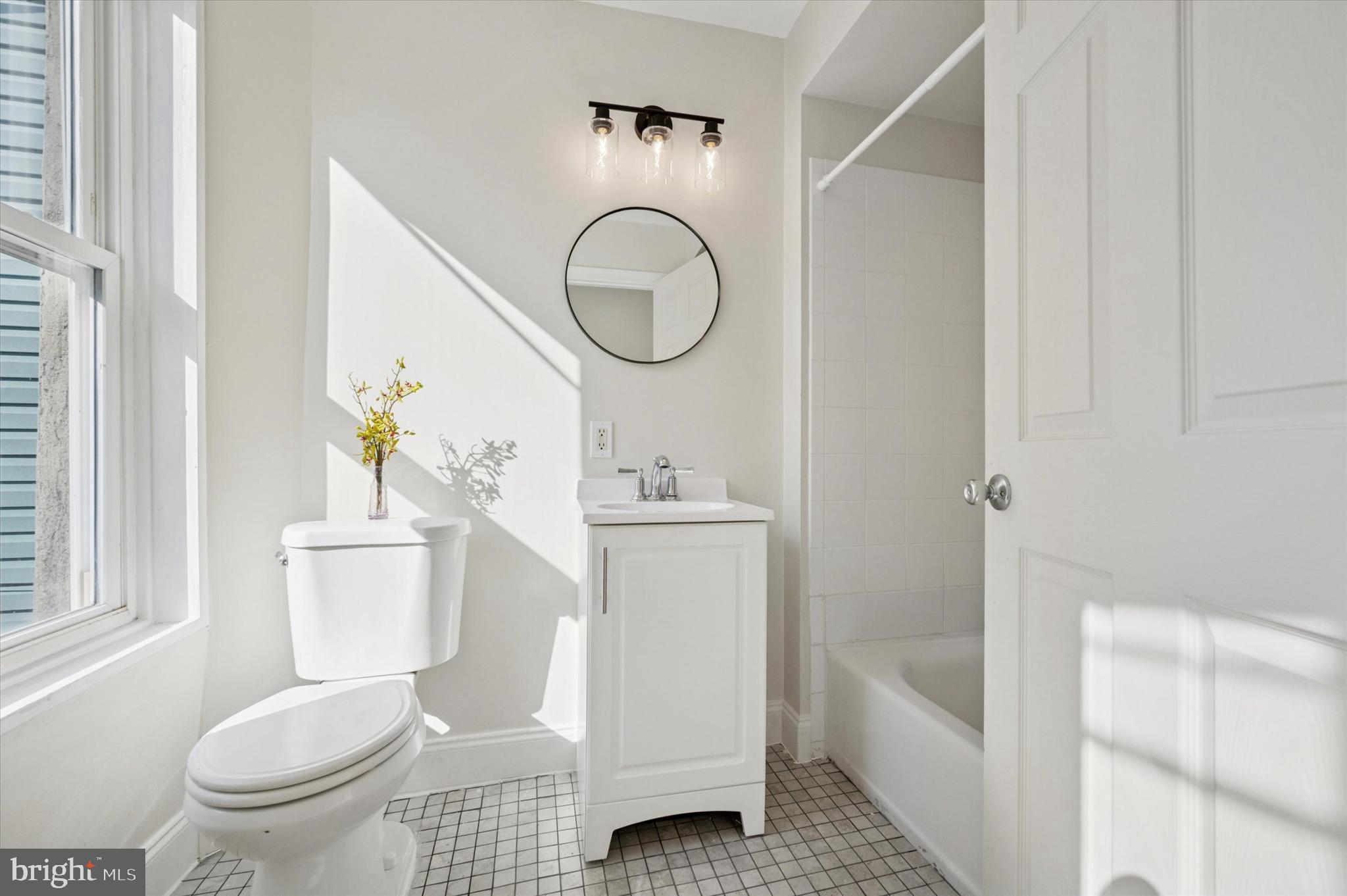 610 Martin Street Philadelphia, PA 19128 - Photo 16 of 24 a bathroom with a sink a toilet and a bathtub