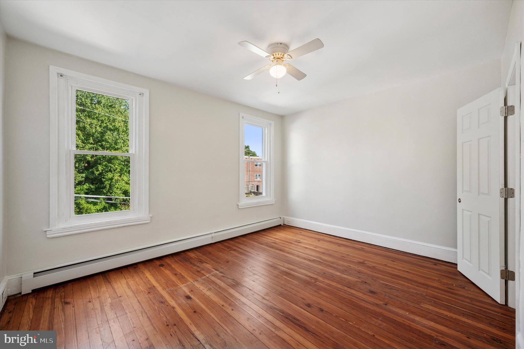 610 Martin Street Philadelphia, PA 19128 - Photo 17 of 24 a view of an empty room with wooden floor and a window
