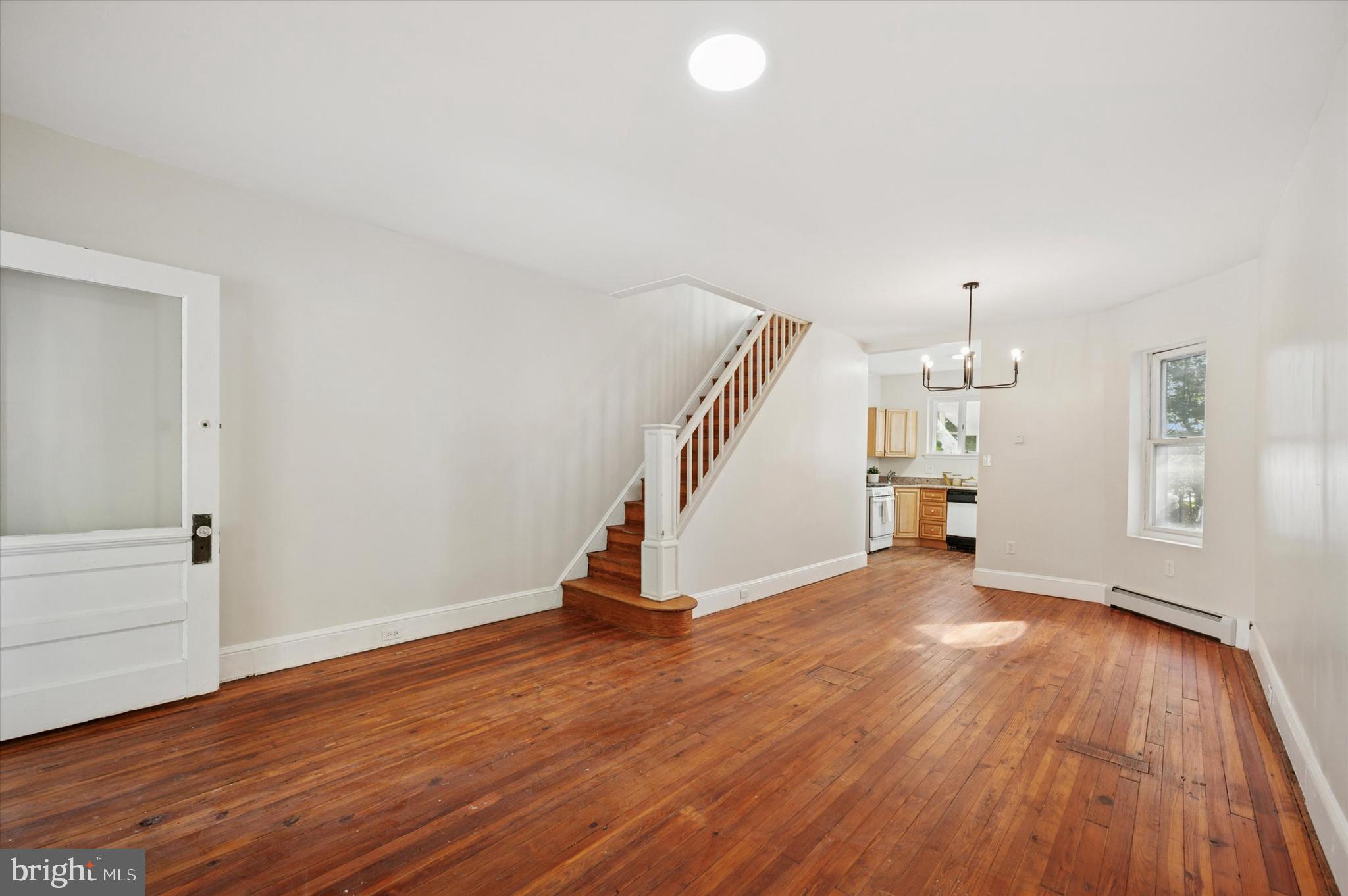 610 Martin Street Philadelphia, PA 19128 - Photo 6 of 24 a view of an empty room with wooden floor and a window