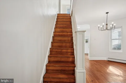 a view of entryway with stairs and wooden floor