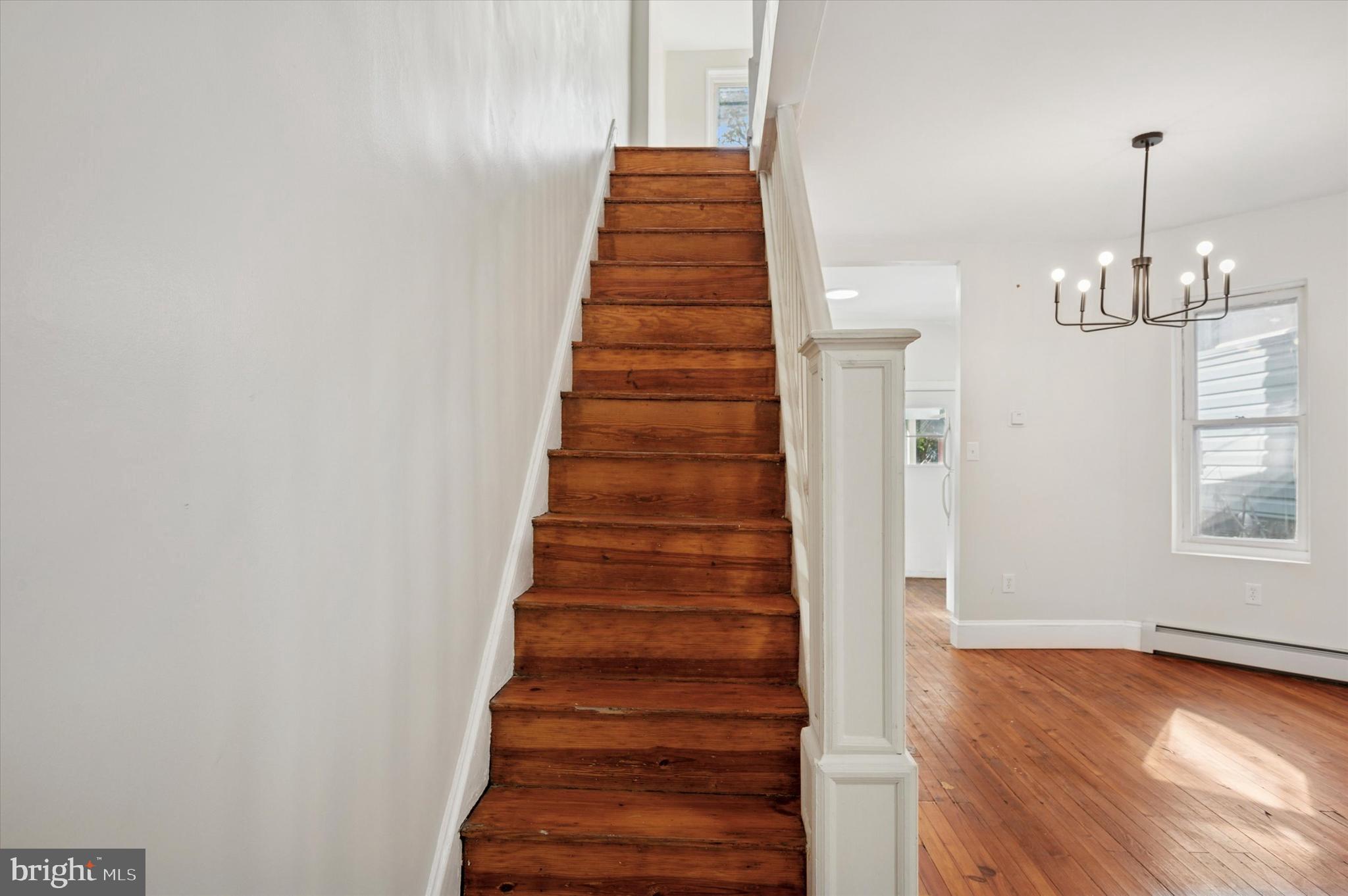 610 Martin Street Philadelphia, PA 19128 - Photo 7 of 24 a view of entryway with stairs and wooden floor