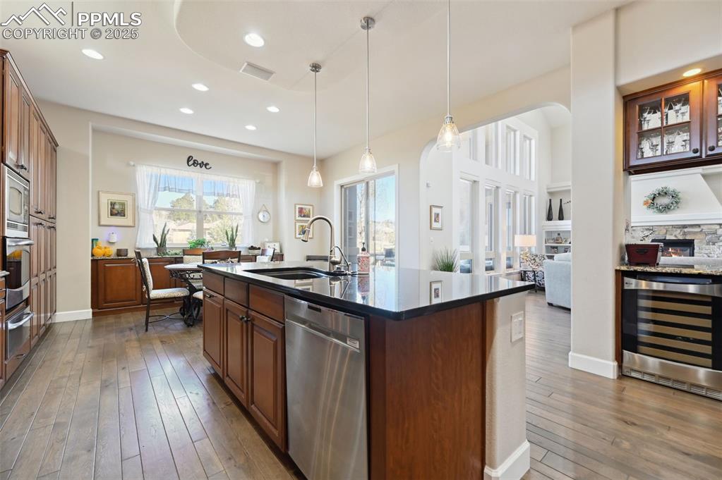 1724 Valley Stream Court Colorado Springs, CO 80921 - Photo 12 of 49 a kitchen with lots of counter top space and wooden floor