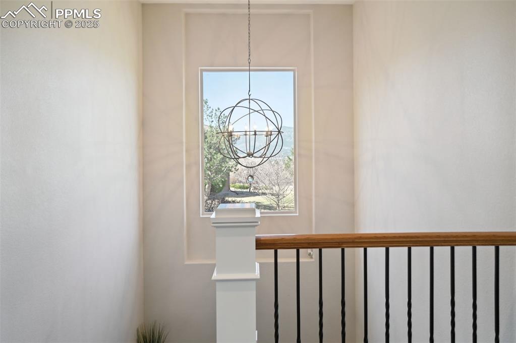 1724 Valley Stream Court Colorado Springs, CO 80921 - Photo 13 of 49 a view of a hallway with wooden floor and a window