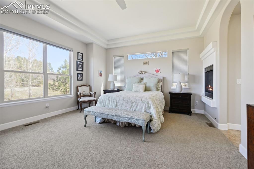 1724 Valley Stream Court Colorado Springs, CO 80921 - Photo 14 of 49 a bed room with a bed and a large window