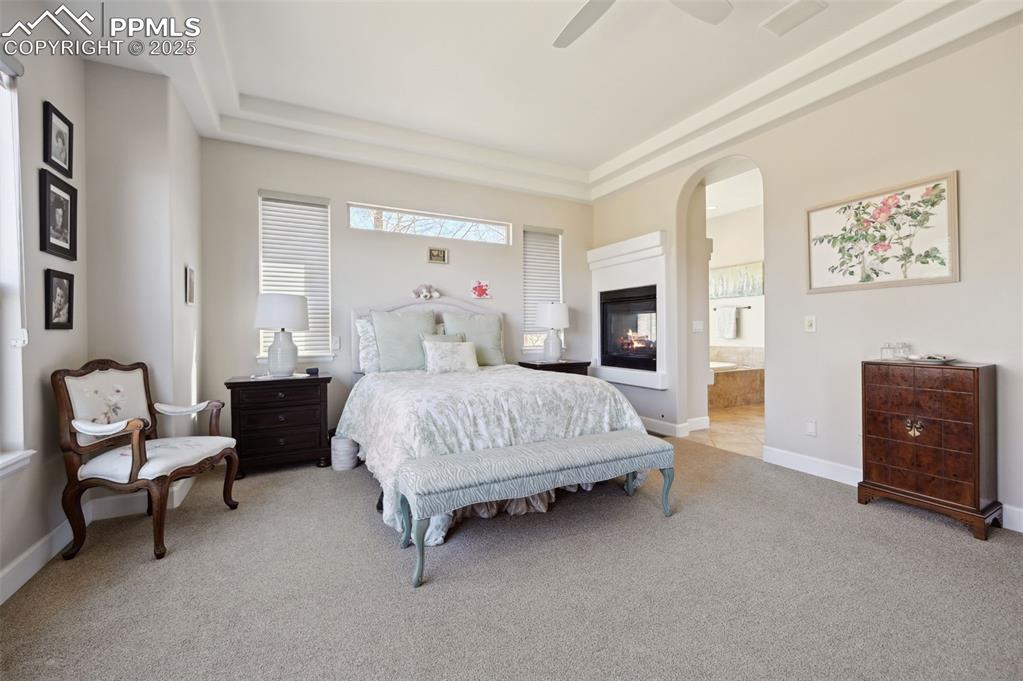 1724 Valley Stream Court Colorado Springs, CO 80921 - Photo 16 of 49 a bedroom with a bed and a couch
