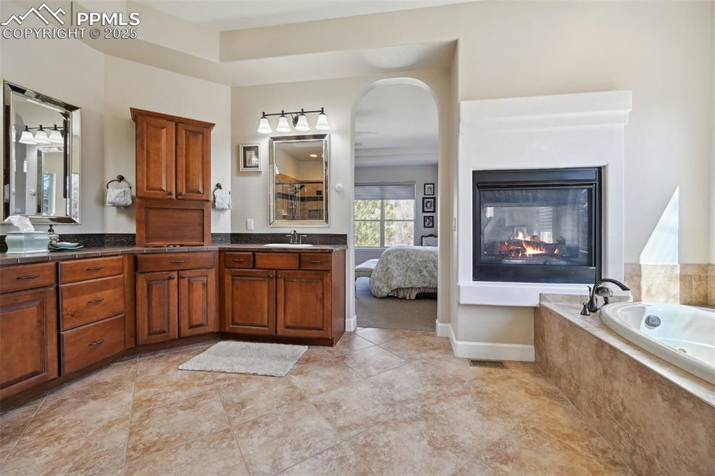 1724 Valley Stream Court Colorado Springs, CO 80921 - Photo 20 of 49 a large spacious bathroom with a large tub and sink
