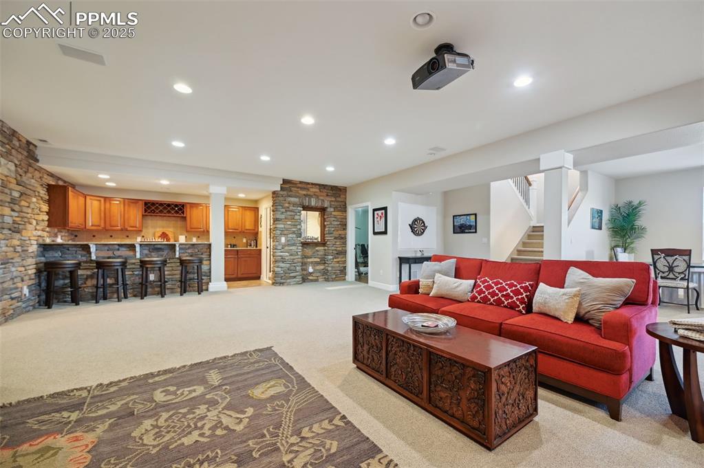 1724 Valley Stream Court Colorado Springs, CO 80921 - Photo 25 of 49 a living room with furniture and a ceiling fan