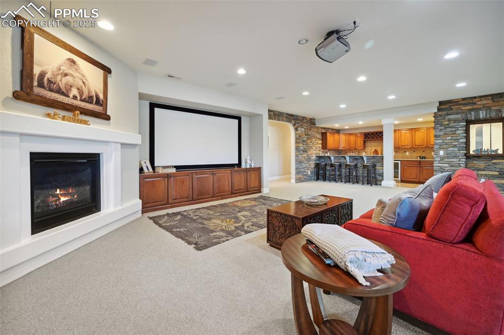 1724 Valley Stream Court Colorado Springs, CO 80921 - Photo 26 of 49 a living room with furniture and a fireplace