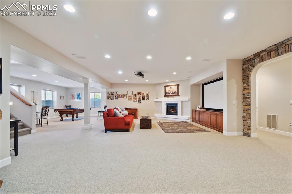 1724 Valley Stream Court Colorado Springs, CO 80921 - Photo 31 of 49 a large room with furniture and natural light