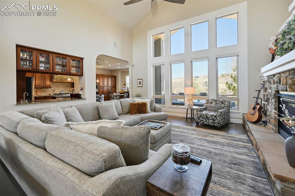 1724 Valley Stream Court Colorado Springs, CO 80921 - Photo 33 of 49 a living room with furniture fireplace and a large window