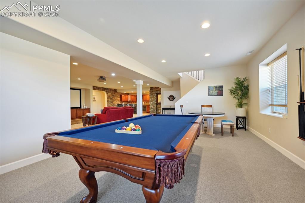 1724 Valley Stream Court Colorado Springs, CO 80921 - Photo 34 of 49 a room with furniture pool table and windows