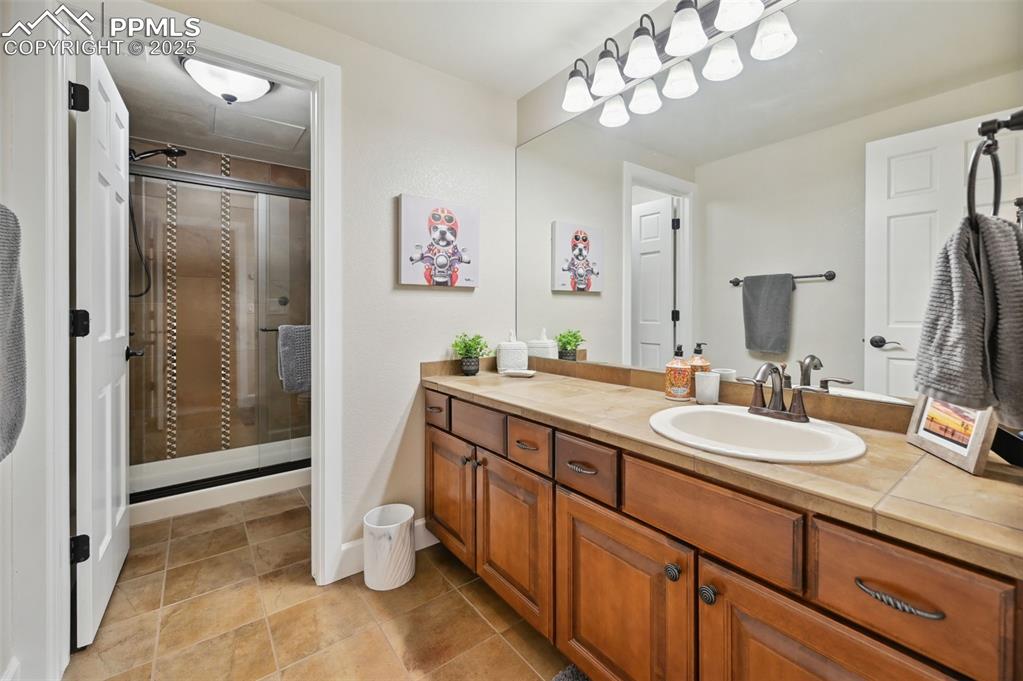 1724 Valley Stream Court Colorado Springs, CO 80921 - Photo 41 of 49 a spacious bathroom with a double vanity sink mirror and double