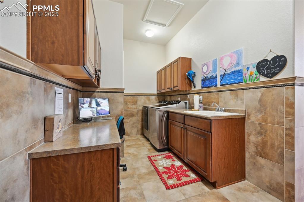 1724 Valley Stream Court Colorado Springs, CO 80921 - Photo 42 of 49 a kitchen with stainless steel appliances granite countertop a sink and a stove