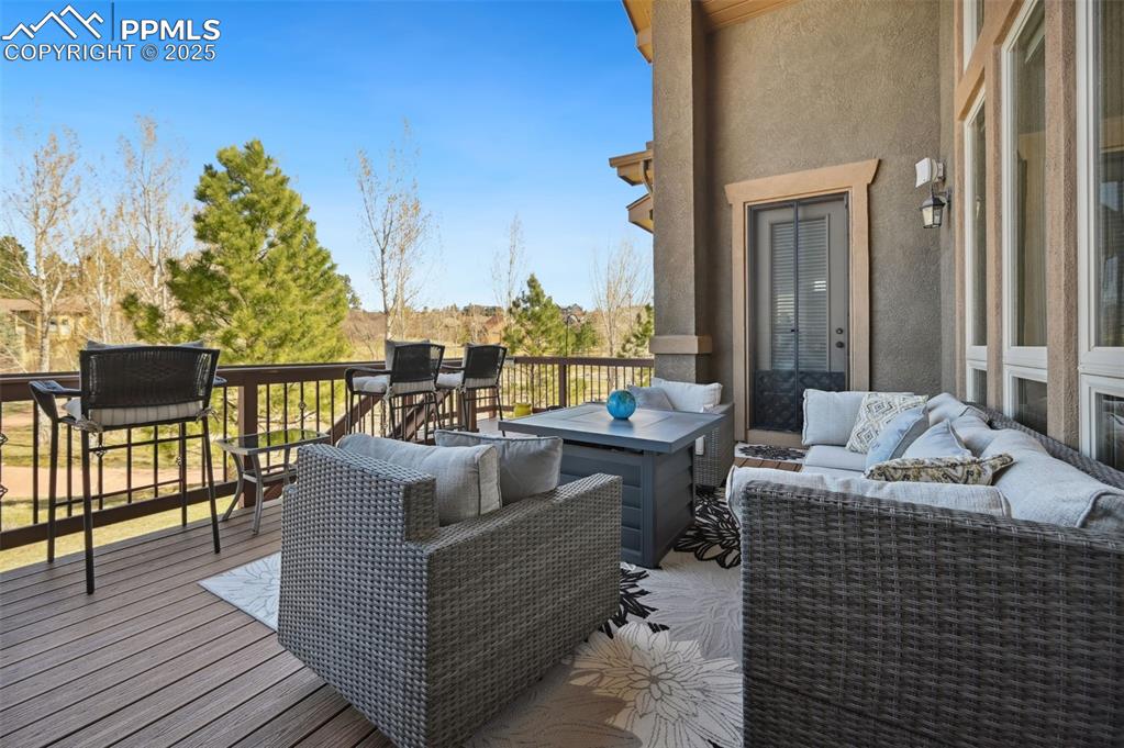 1724 Valley Stream Court Colorado Springs, CO 80921 - Photo 45 of 49 a balcony with furniture and a potted plant