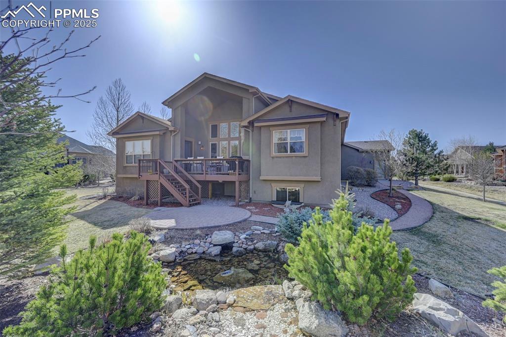 1724 Valley Stream Court Colorado Springs, CO 80921 - Photo 49 of 49 a front view of a house with garden