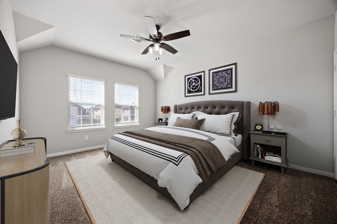 18606 Lansdowne Stream Path Katy, TX 77449 - Photo 11 of 39 The spacious primary bedroom offers tons of natural sunlight