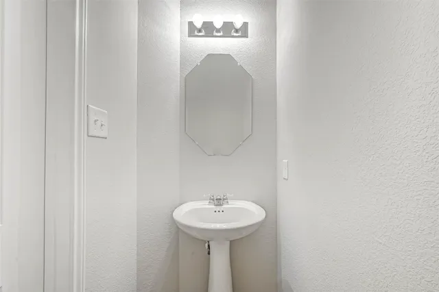 a view of small space with wooden floor and windows