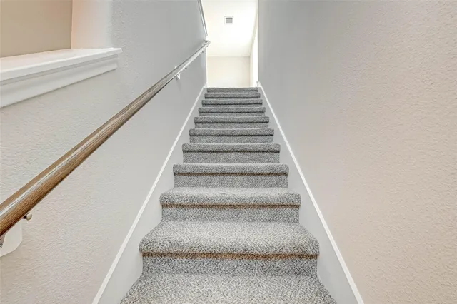 a bathroom with a sink a shower and a mirror