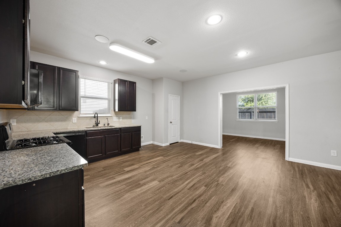 18606 Lansdowne Stream Path Katy, TX 77449 - Photo 23 of 39 The kitchen is conveniently located next to the separate dining room, perfect for hosting and entertaining.