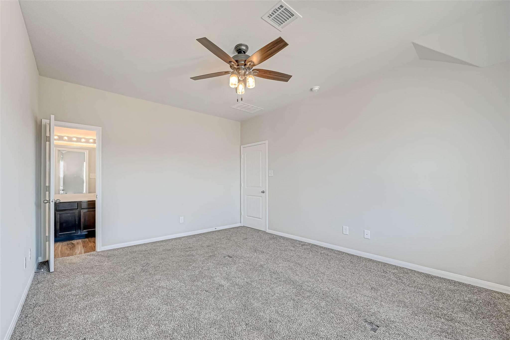 18606 Lansdowne Stream Path Katy, TX 77449 - Photo 27 of 39 an empty room with closet and fan